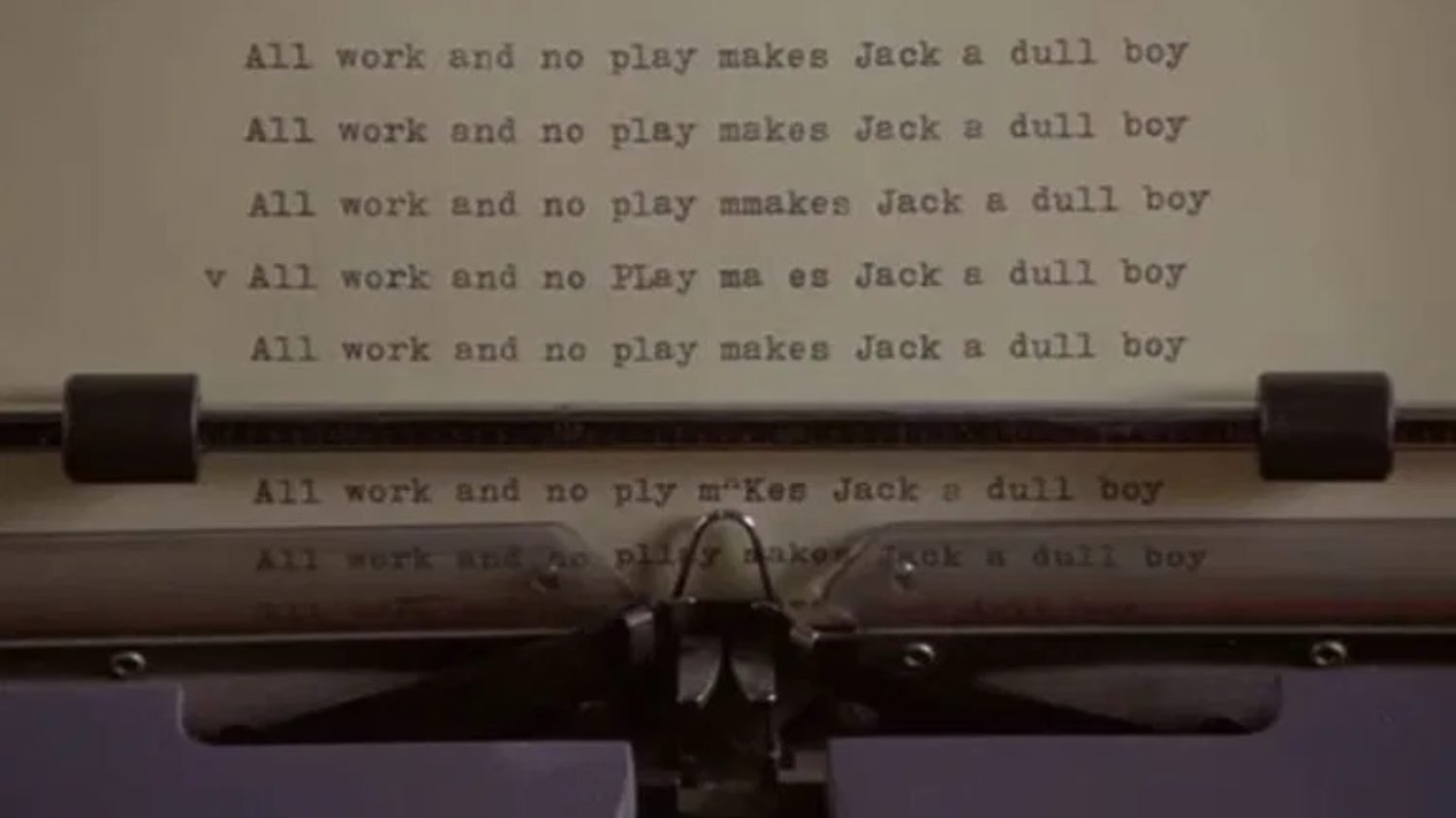 Typewriter spitting out paper with "All work and no play makes Jack a dull boy" from The Shining